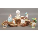 A set of seven Beswick Beatrix Potter figures with Beswick tree stump stand. Some of the figures