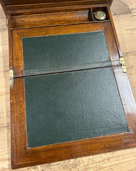 An oak stationary box with bottom draw developing into a writing slope brass handle is detached - Image 7 of 8