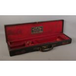 A late 19th/early 20th century gun case by William Evans, Pall Mall. The top stamped for Lt Col FH