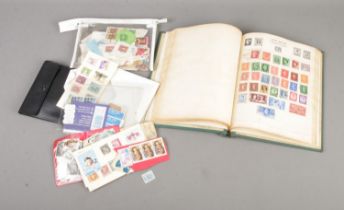 A collection of assorted world stamps to include Victorian Penny Red (with date stamp for 1866),