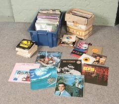 Two boxes of assorted vinyl records and singles of mainly pop and easy listening to include Elvis