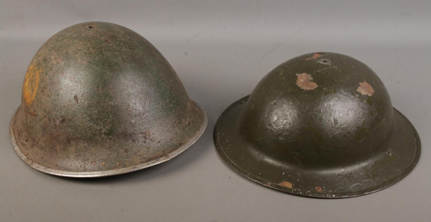 Two British military helmets including a Mk2 and Mk4 example