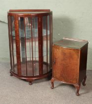 A vintage mahogany display cabinet with mirrored back with a burr walnut bedside cabinet.