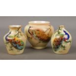 Three small Locke & Co Worcester vases. All hand painted and decorated with a peacock. Signed H