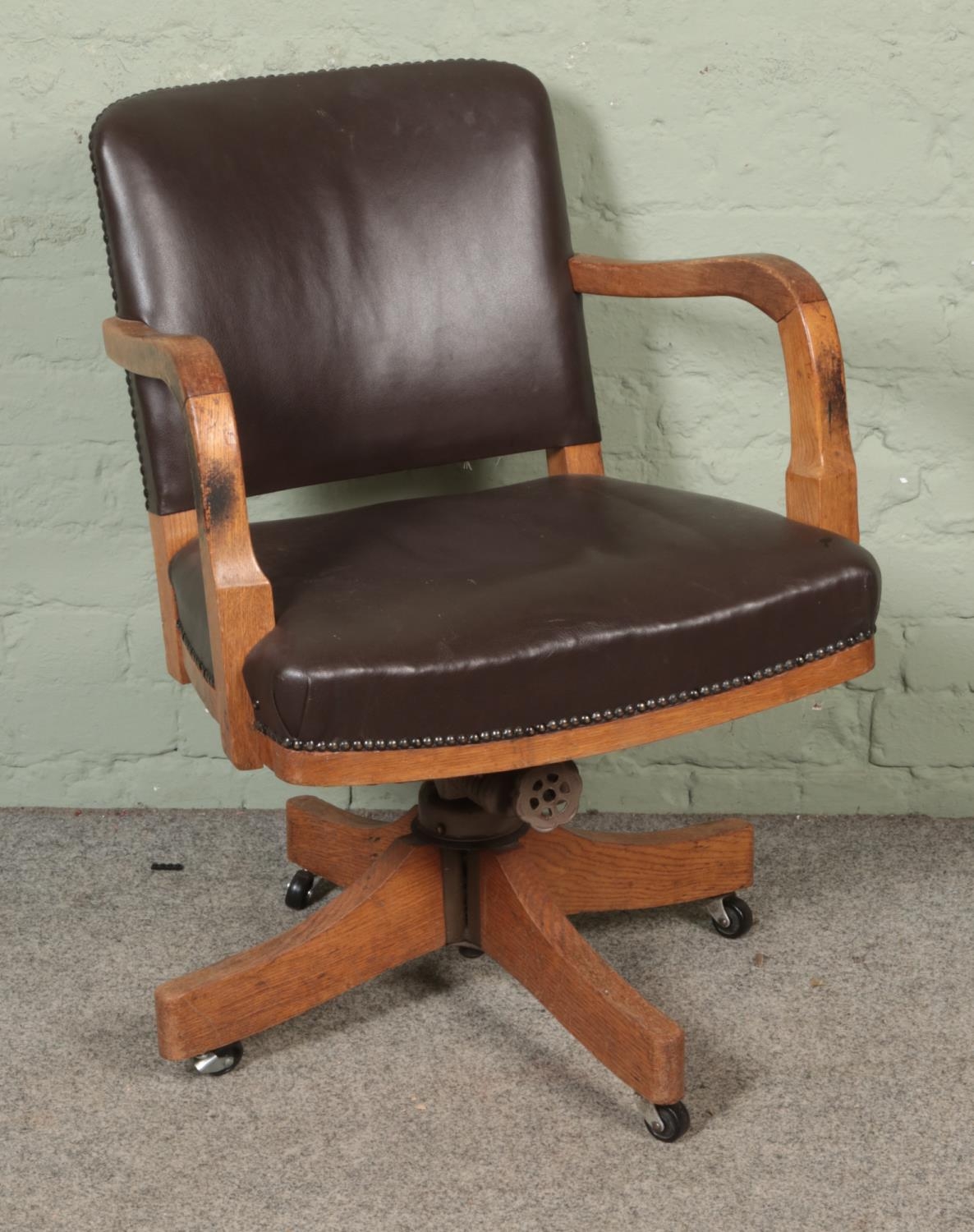 A mid 1940's Astrola office desk chair with leather upholstery