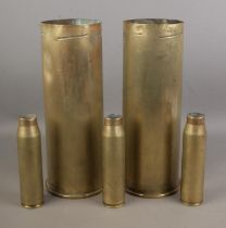 A collection of shell cases including two large examples dates 1989