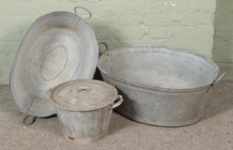 Two galvanised bath/tubs with another galvanised lidded pot Largest Hx30cm Wx77cm
