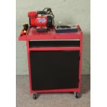 A red and black tool cabinet on casters with contents of assorted tools to include Clarke Wiz Air