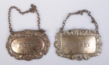 Two 1970s silver spirit decanter labels; Port and Sherry. Assay marks for London 1975 and Birmingham