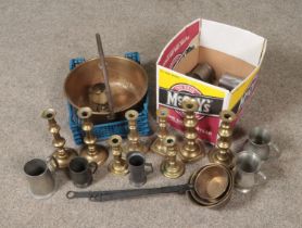 Two boxes of metalwares. Includes brass jam pan, brass candlesticks and pewter tankards.