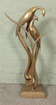In the style of Dolbi Cashier, a large brass sculpture, 'Lovebirds'. Height: 99cm, Width at base: