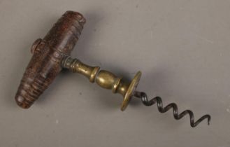 A Henshall type 19th century corkscrew with brass shank design with wood turned handle.