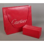 Cartier, an empty sunglasses box along with associated bag.