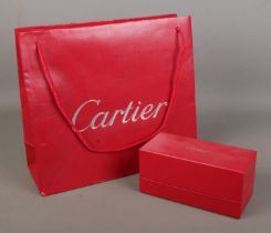 Cartier, an empty sunglasses box along with associated bag.