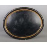 A large tole ware tray featuring gilt decorated border. Width 62cm.