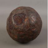 A large antique iron cannon ball. Diameter approximately 15cm.