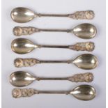 A set of six continental silver demitasse spoons. Having rose decoration finials and stamped 800.