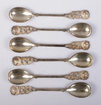 A set of six continental silver demitasse spoons. Having rose decoration finials and stamped 800.