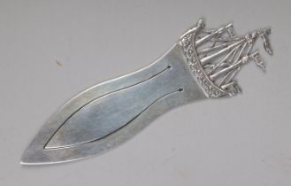 A silver book mark in the style of a ship assayed Birmingham 1905, Bishton & Fletcher. 13.1g.