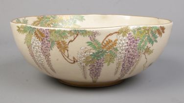 A Japanese Kinkozan bowl decorated with Wisteria. Signed to base. Height 8cm, Diameter 21cm.