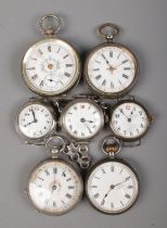 Seven assorted silver fob watches and watch heads; the four fob watches all stamped 935. Some for