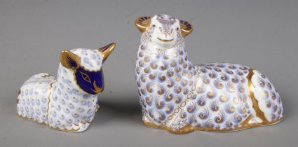 A Royal Crown Derby Sheep and Lamb paperweight both with silver stopper.