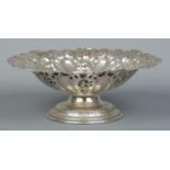 An Edwardian silver pedestal dish with repousse decoration. Assayed Birmingham 1901 by Charles