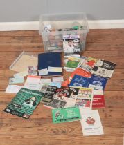 A box of assorted football ephemera to include books, small collection of 1960's football