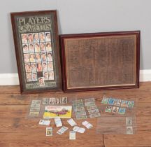 A collection of assorted cigarette cards to include Players, Brooke Bond, etc. Along with a framed