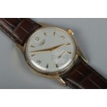 A gents 9ct gold Longines manual wristwatch. Having subsidiary seconds and baton and Arabic