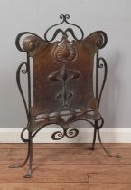 An Arts & Crafts copper and iron fire screen. Height 81.5cm.