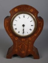 A mahogany inlaid balloon mantle clock featuring enamel face, roman numeral dial and floral