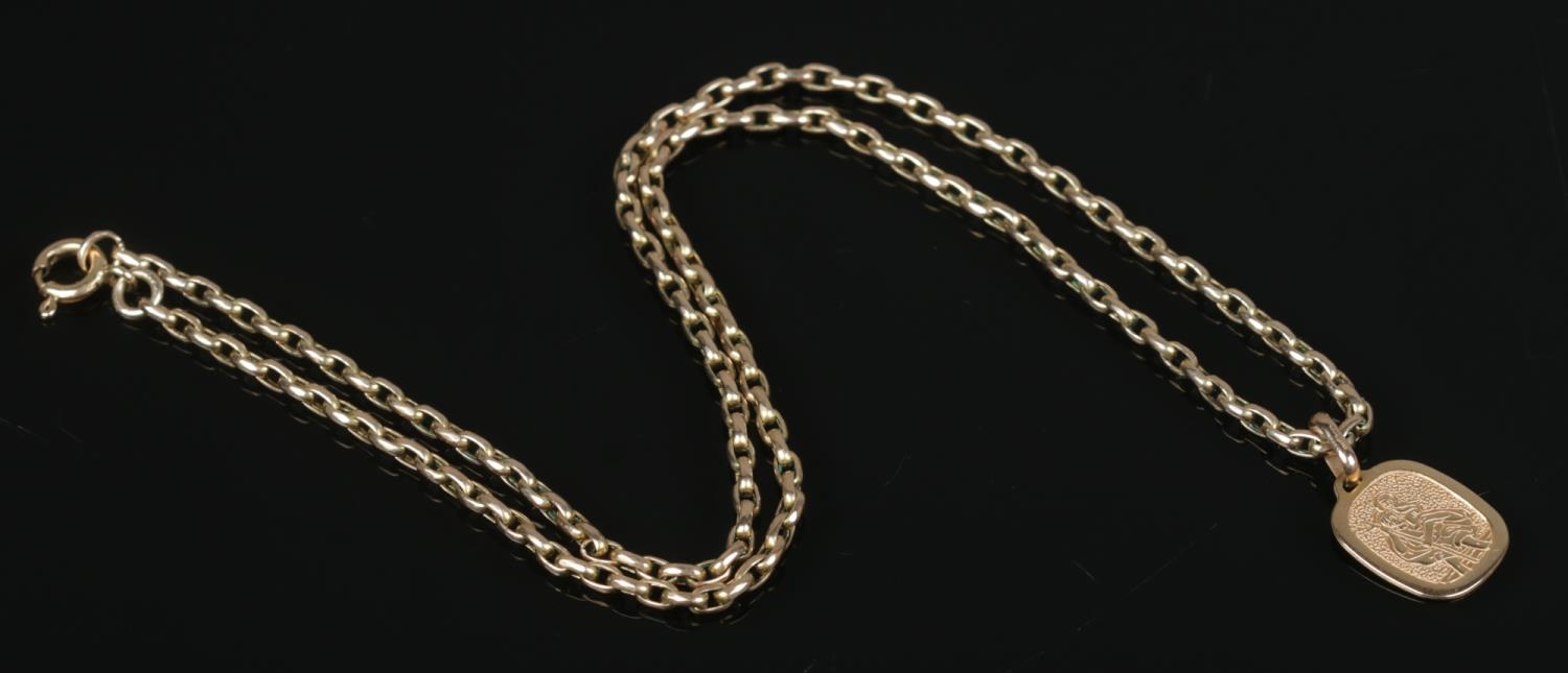 A 9ct gold rolo link necklace with 9ct gold St Christopher pendant. Length of chain 50cm. 13.04g. - Image 2 of 2