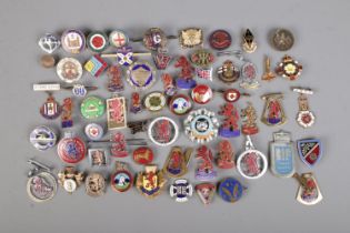 A large collection of mainly enamel badges, to include British Red Cross, Butlins, Empire Exhibition