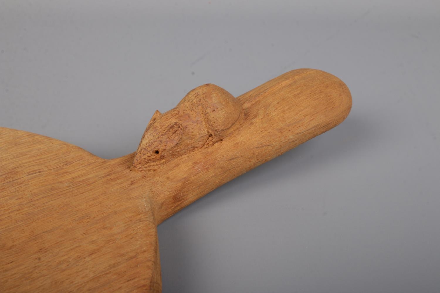 Robert 'Mouseman' Thompson, an oak cheese board with handle and signature mouse carving. Length 39. - Image 2 of 2