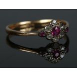 An 18ct gold and diamond cluster ring. Size O. 1.67g.