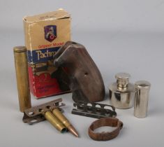 A small collection of gun related items. Includes pistol grip, 1856 pattern rifle band, Lee