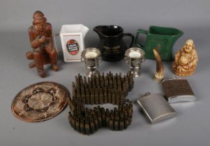 A quantity of collectables to include two used machines gun belts, whiskey jugs, flasks, small horn,