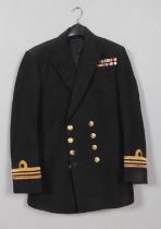 A British Royal Navy Lieutenant Commander uniform jacket.