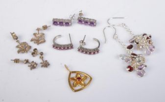 A collection of silver jewellery, mainly earrings, to include six stone garnet, three stone amethyst