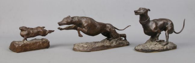 Michael Lyne, a set of three bronze sculptures modelled as two coursing dogs chasing a hare. All