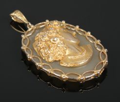 A 9ct gold, agate and diamond pendant, portrait of a maiden in high relief. Assay marks for London