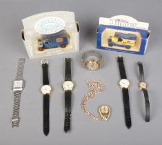 Two boxed Diecast promotional vehicles along with a collection of assorted wristwatches to include