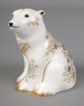 A Royal Crown Derby polar bear sitting paperweight with gold stopper.