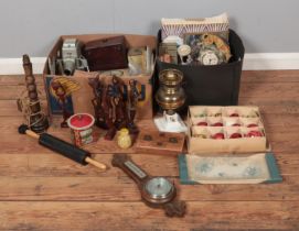 Two boxes of miscellaneous to include vintage tins, carved figures, art glass, costume jewellery,