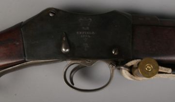 A Victorian Enfield Martini Henry MkIII rifle. Dated 1884. With sling and socket bayonet in