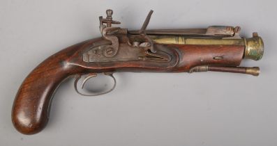A flintlock pistol with flick over knife to top of barrel. Total length 28cm. CANNOT POST. We can
