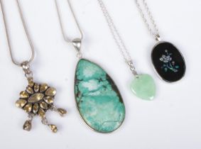 Four silver pendants on chains most set with polished gemstones. Approx. total weight 38g.