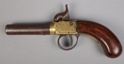 A 19th century percussion cap pistol with cylindrical barrel. Length 18cm. CANNOT POST OVERSEAS.