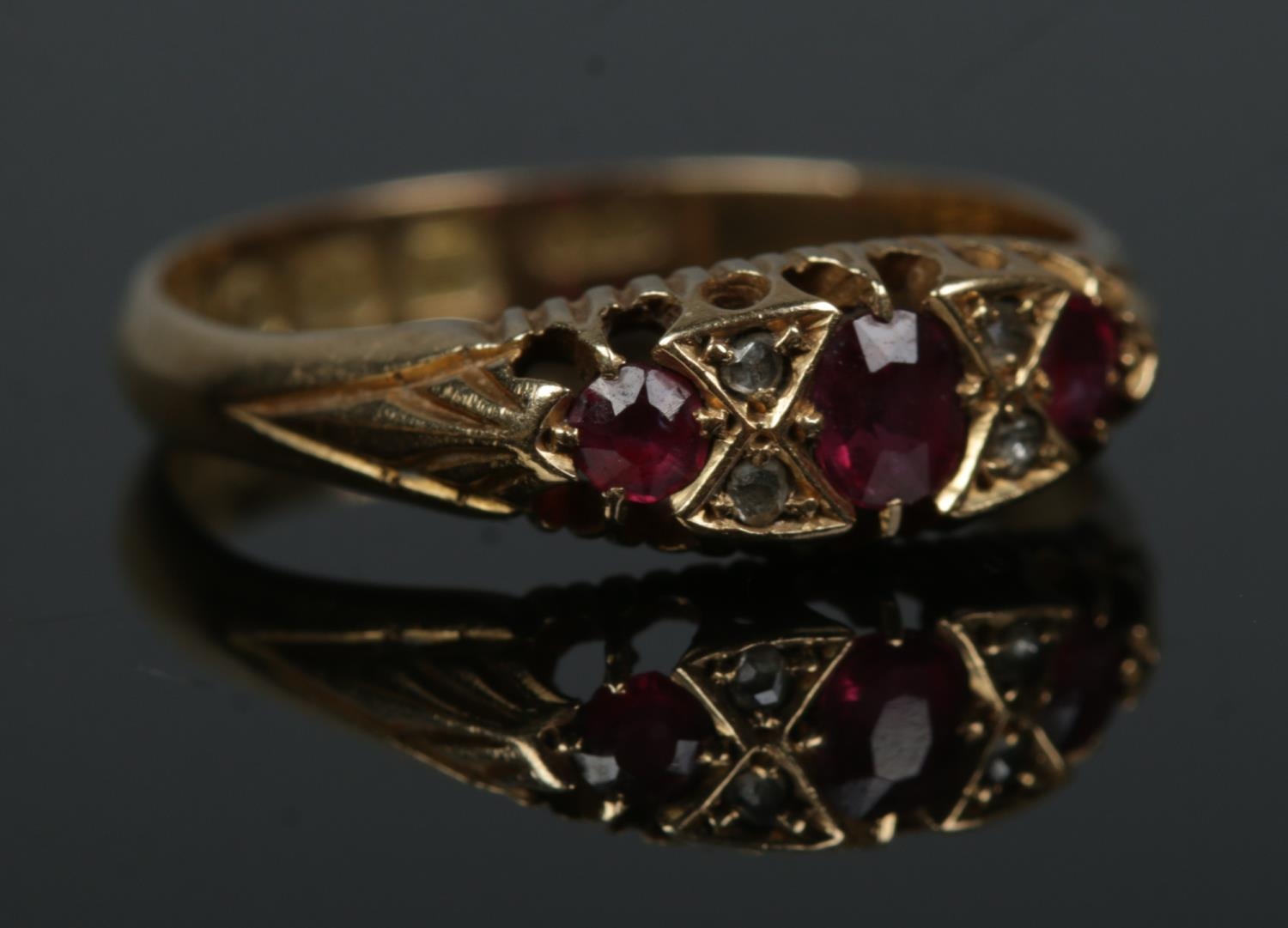 An early 20th century 18ct gold ruby and diamond ring. Size N. 2.62g.